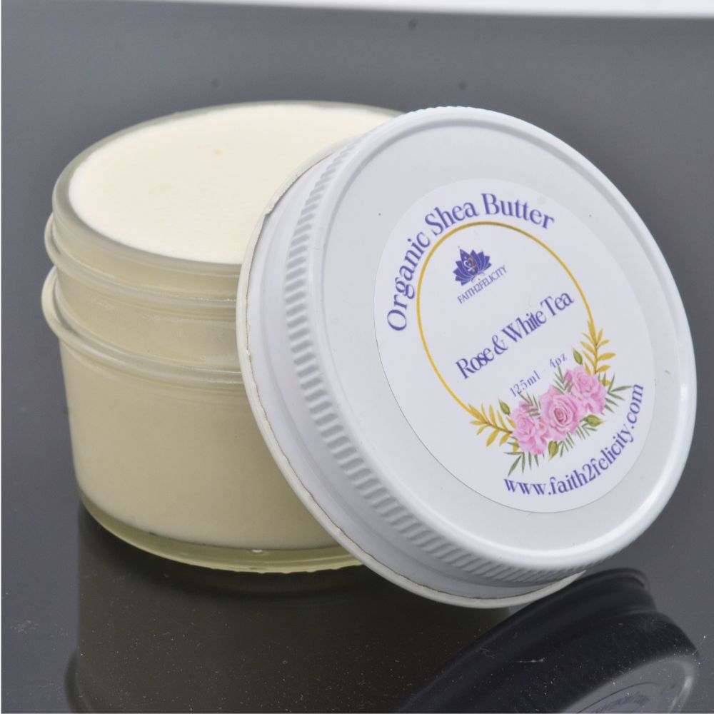Jar of organic shea butter with a decorative label on a reflective surface